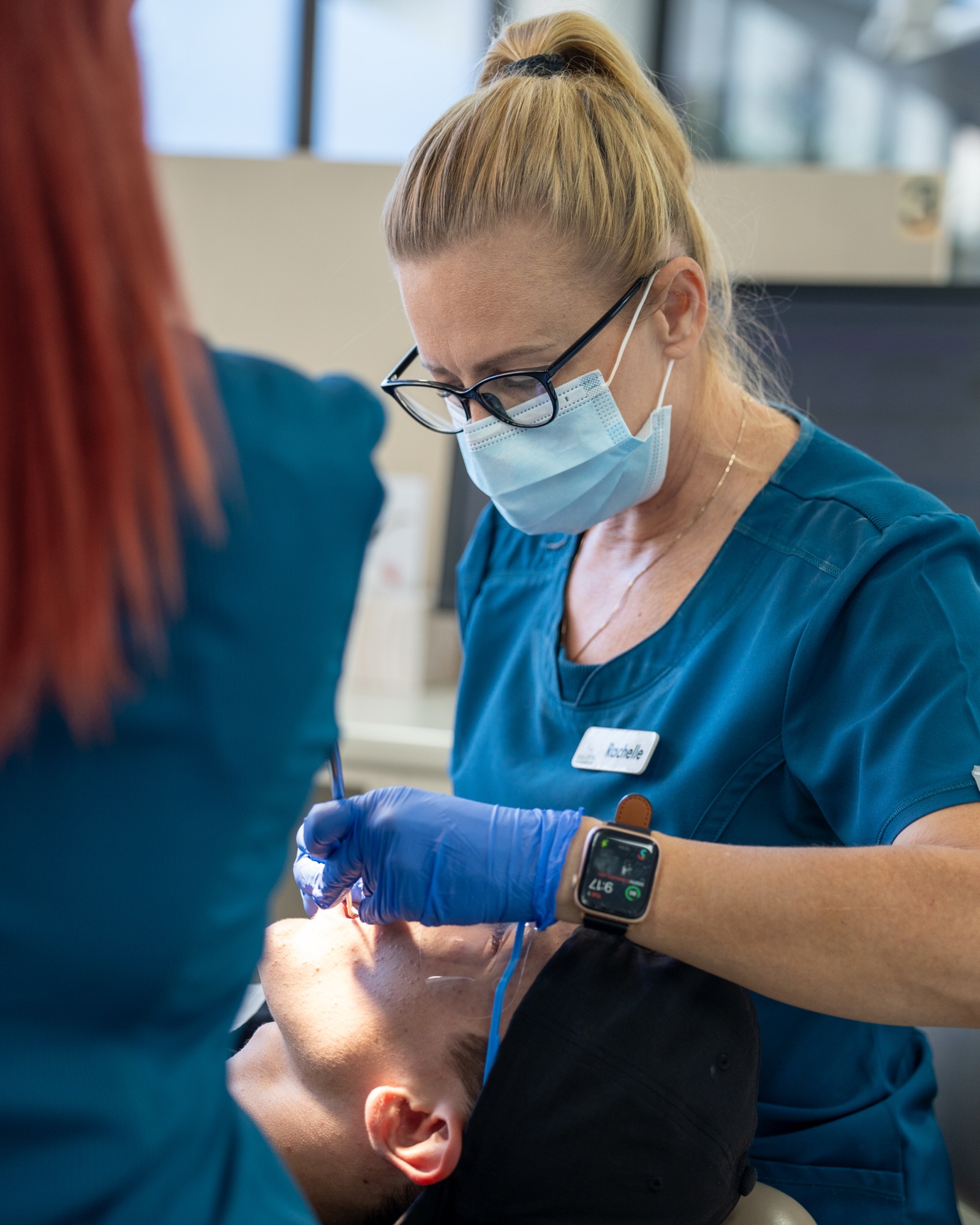 Female dentist treating a patient