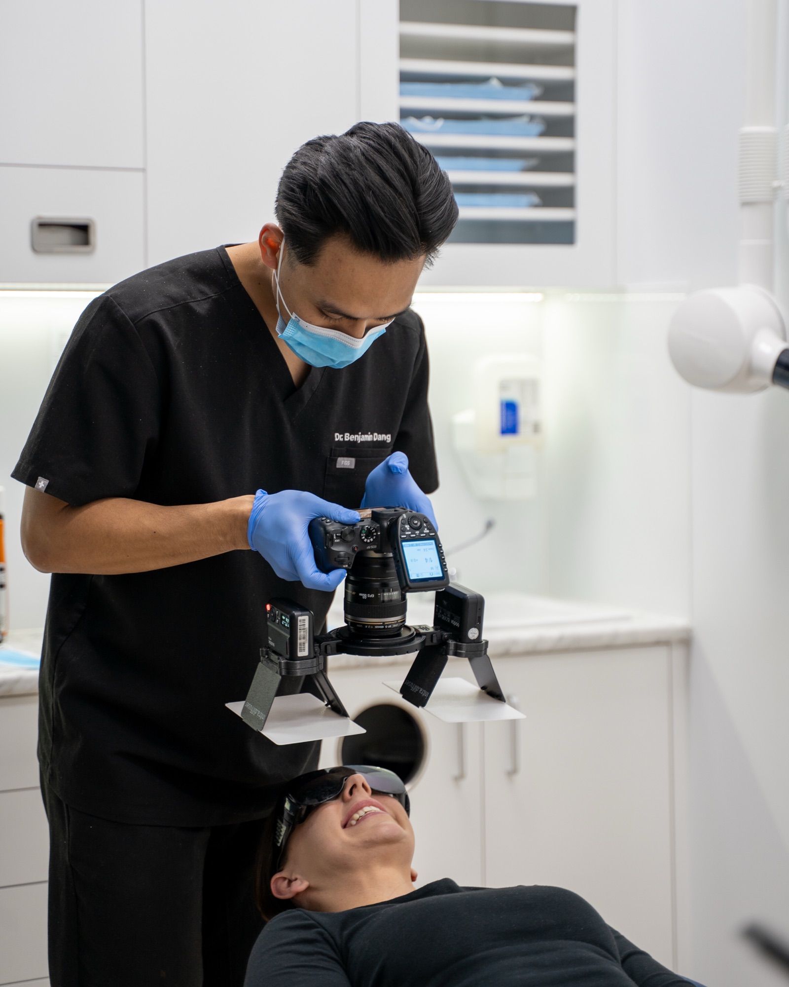 Dentist photographing patient's teeth
